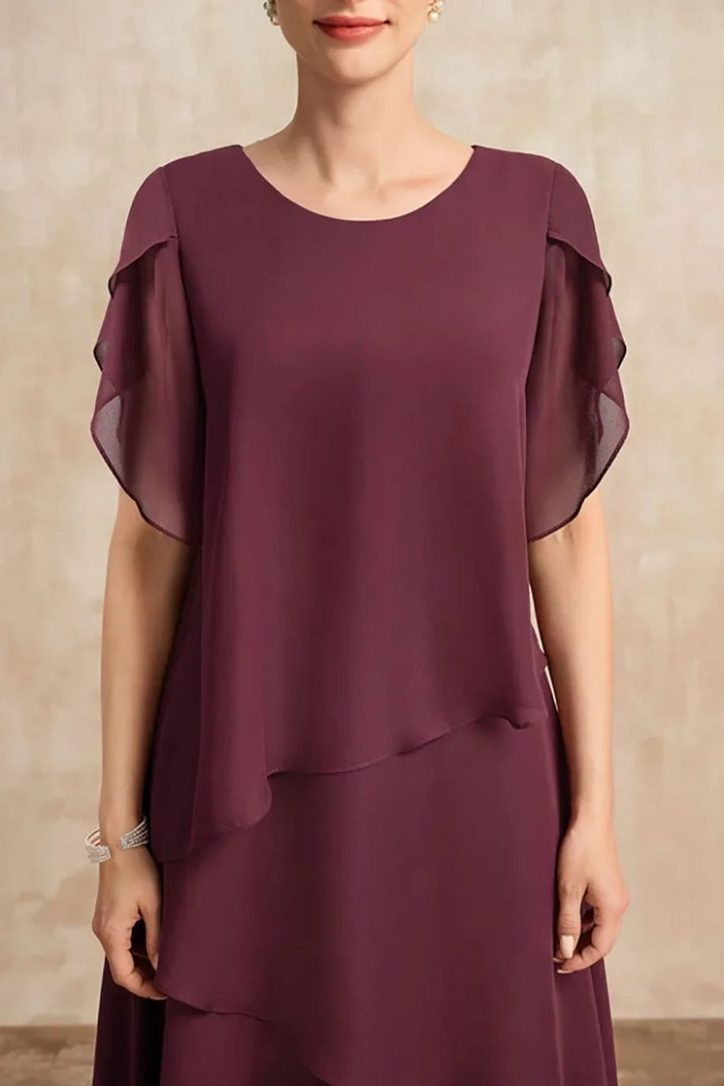 Classic chiffon dress with flowing silhouette, perfect for warm days.