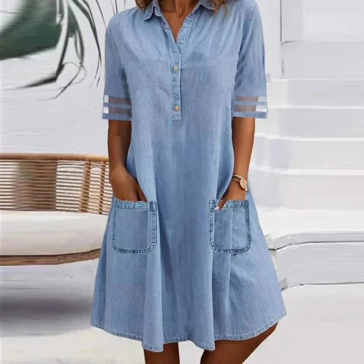 Denim mini dress with side pockets, relaxed fit, durable.