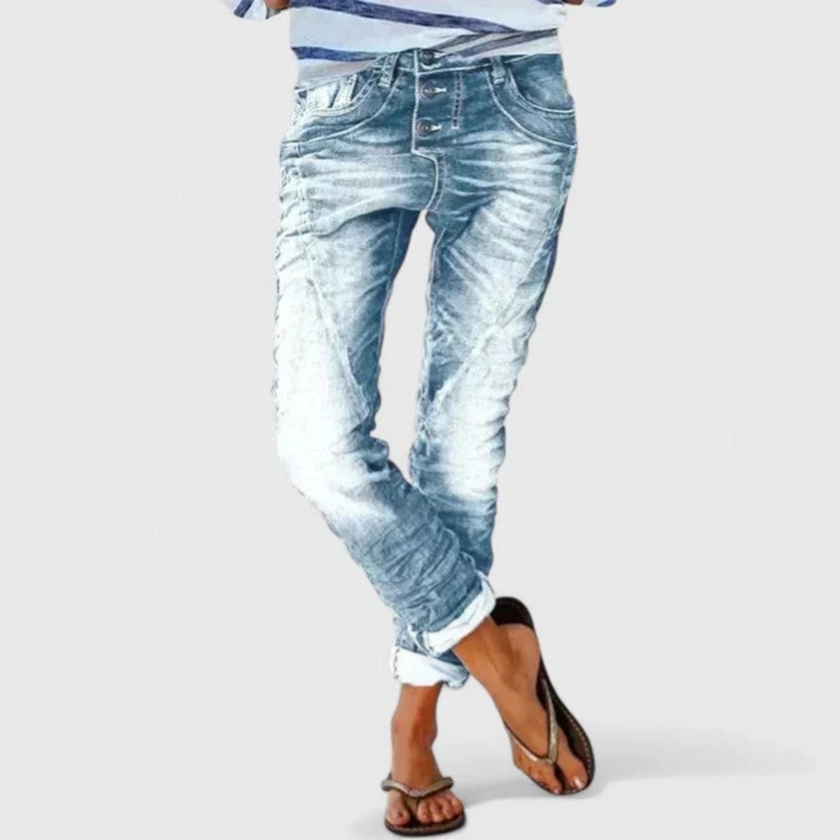 Wide-leg distressed jeans with cuffed hem and mid-rise waist.