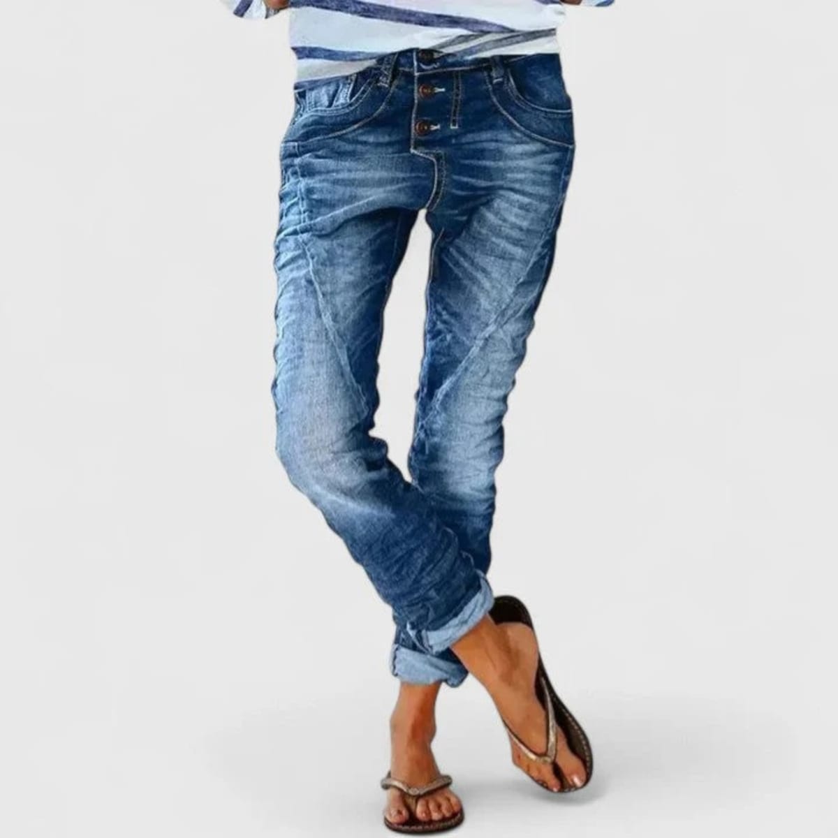 Wide-leg distressed jeans with cuffed hem and mid-rise waist.