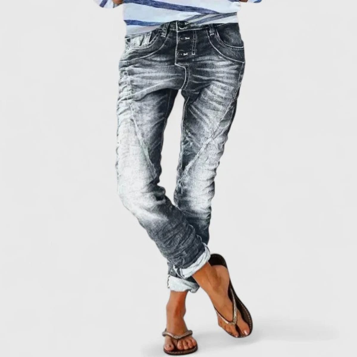 Wide-leg distressed jeans with cuffed hem and mid-rise waist.