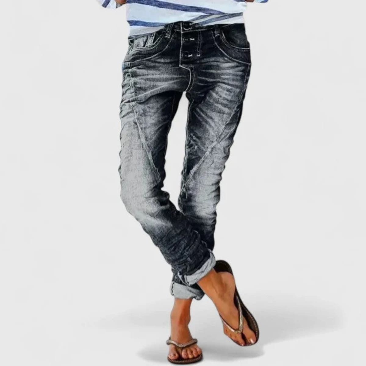 Wide-leg distressed jeans with cuffed hem and mid-rise waist.