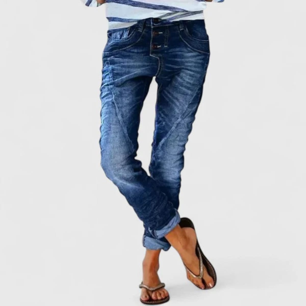 Wide-leg distressed jeans with cuffed hem and mid-rise waist.