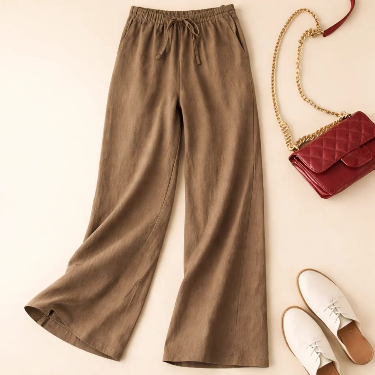 Relaxed drawstring pants with a loose fit and deep pockets.