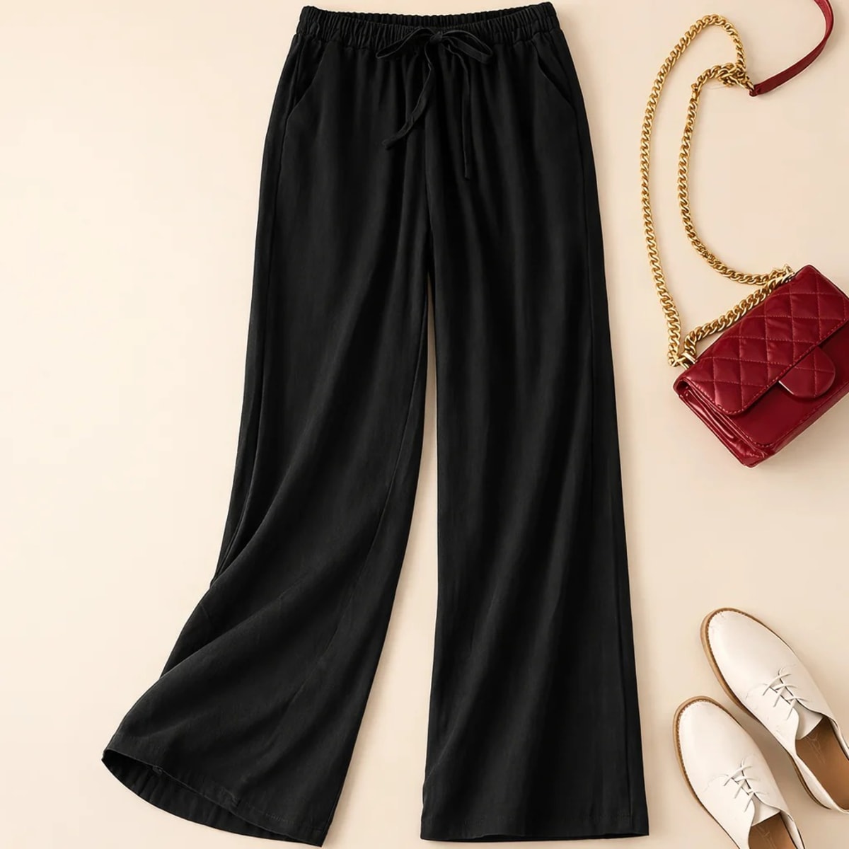 Relaxed drawstring pants with a loose fit and deep pockets.