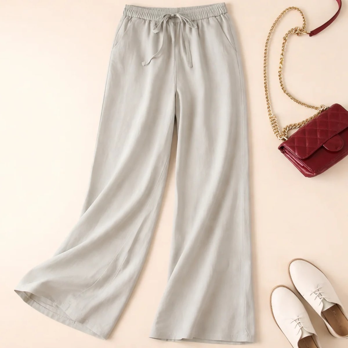 Relaxed drawstring pants with a loose fit and deep pockets.