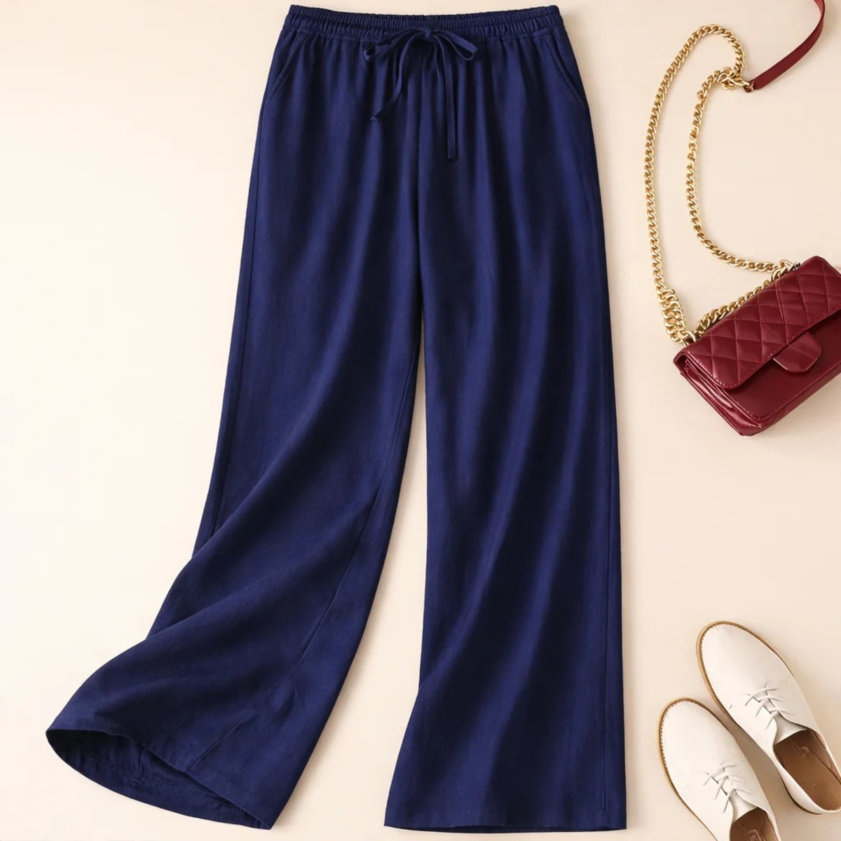 Relaxed drawstring pants with a loose fit and deep pockets.