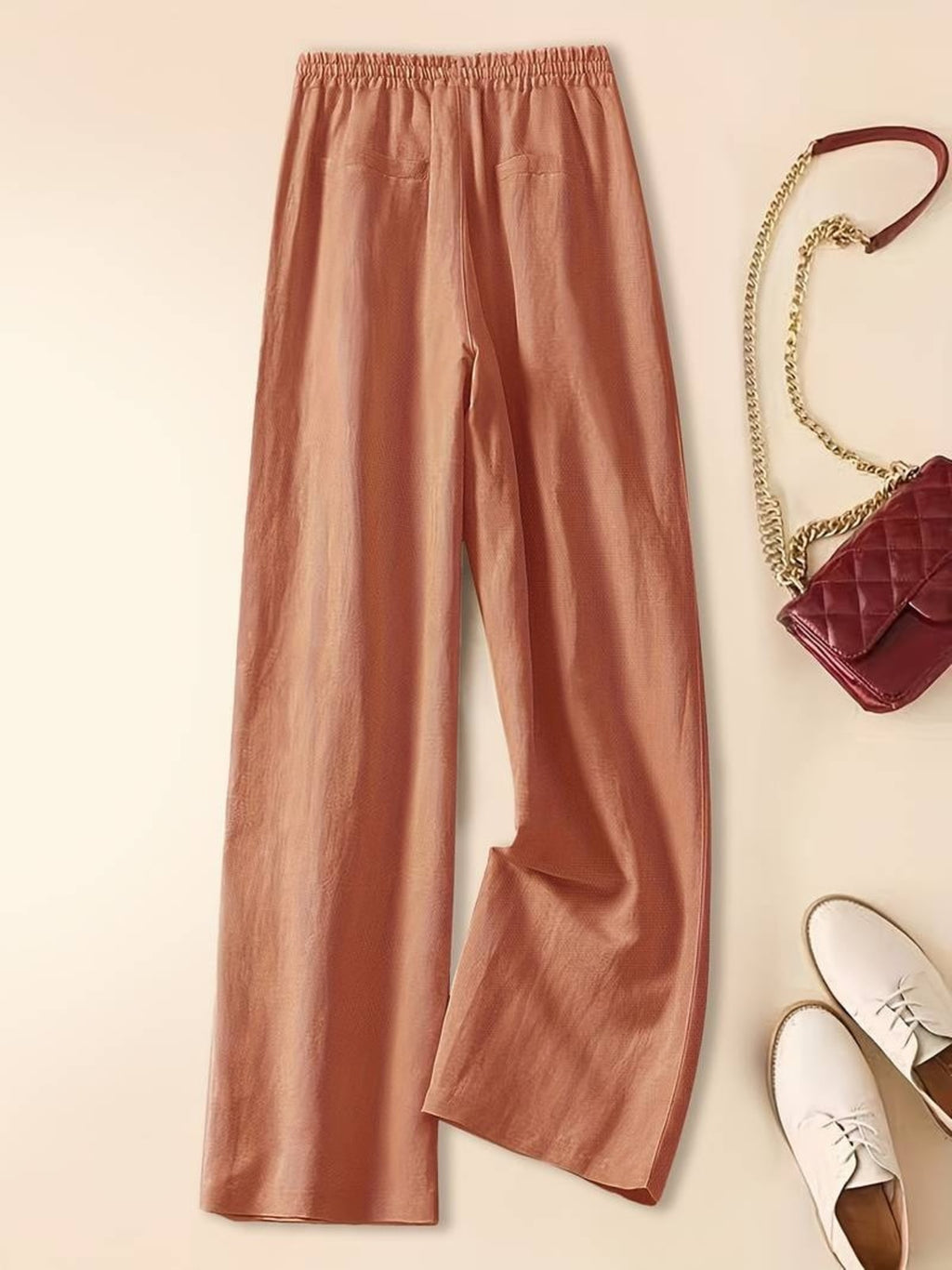 Relaxed drawstring pants with a loose fit and deep pockets.