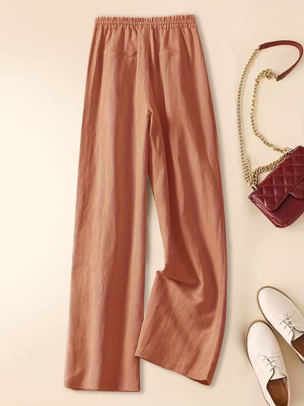 Relaxed drawstring pants with a loose fit and deep pockets.