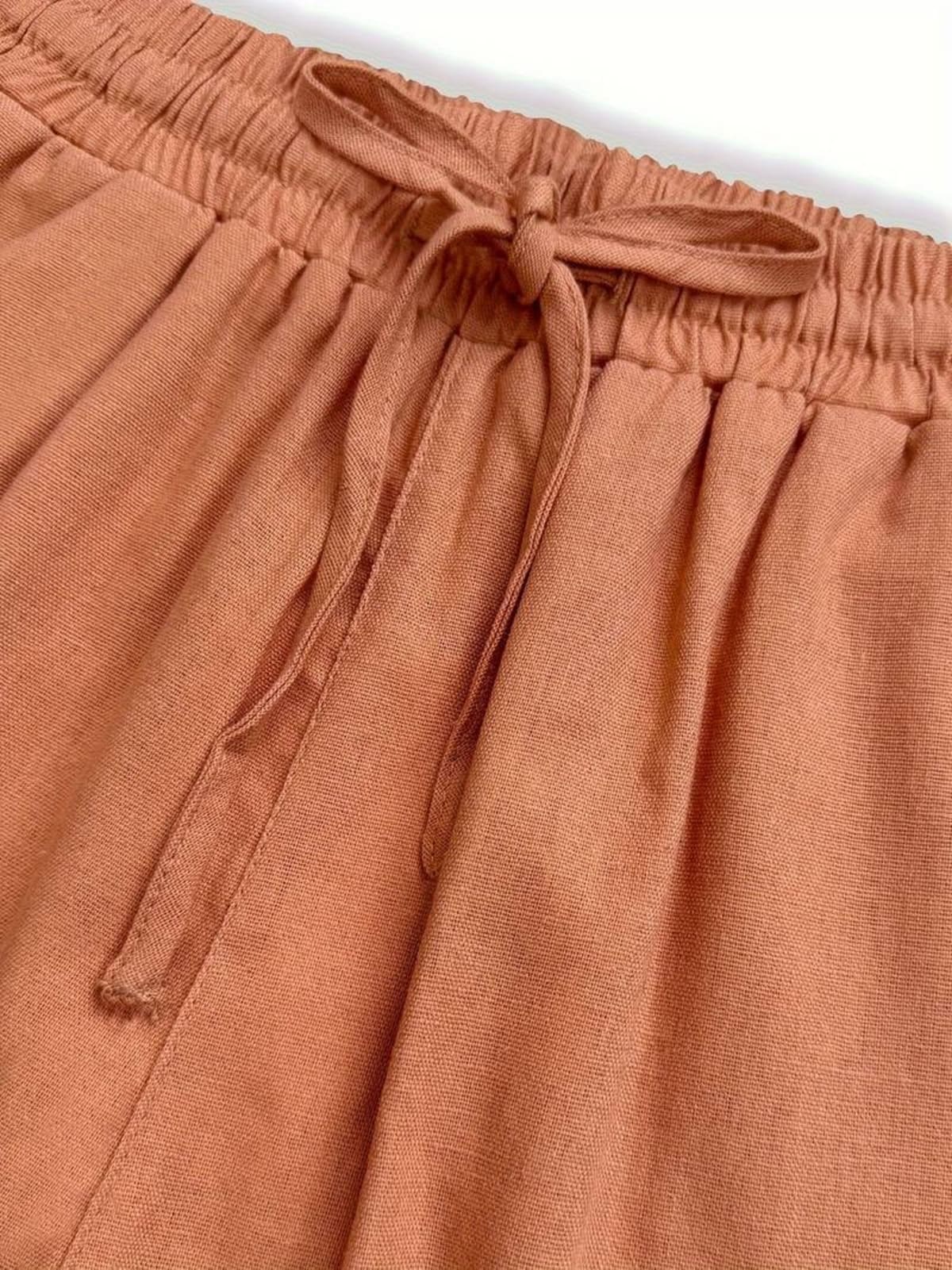 Relaxed drawstring pants with a loose fit and deep pockets.