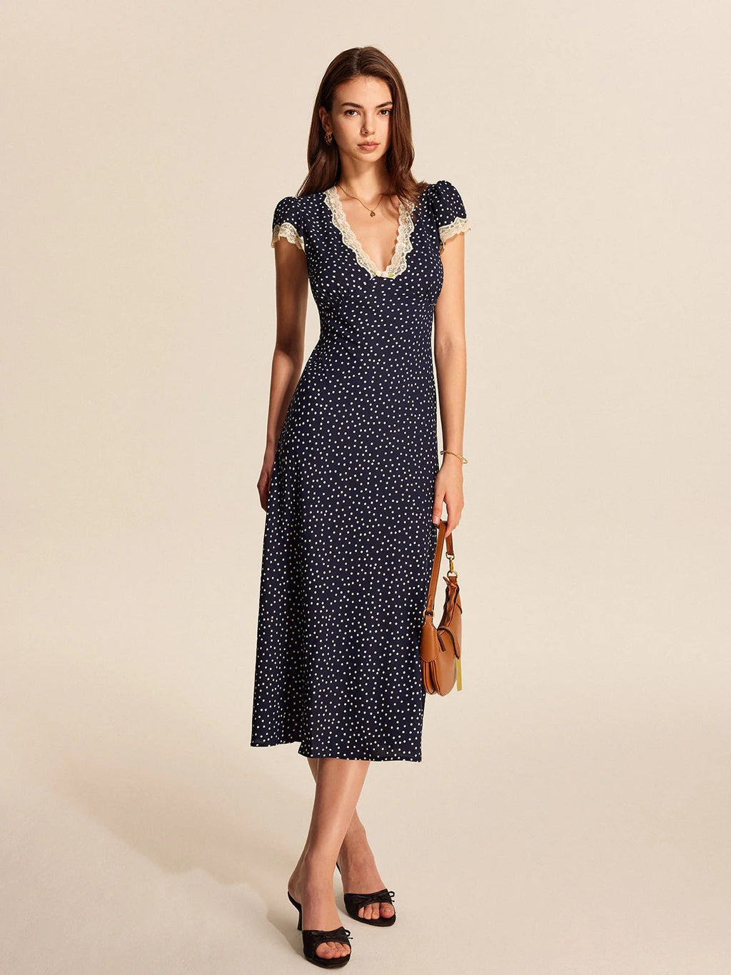 Lace trim polka dot midi dress with cap sleeves and V-neckline.
