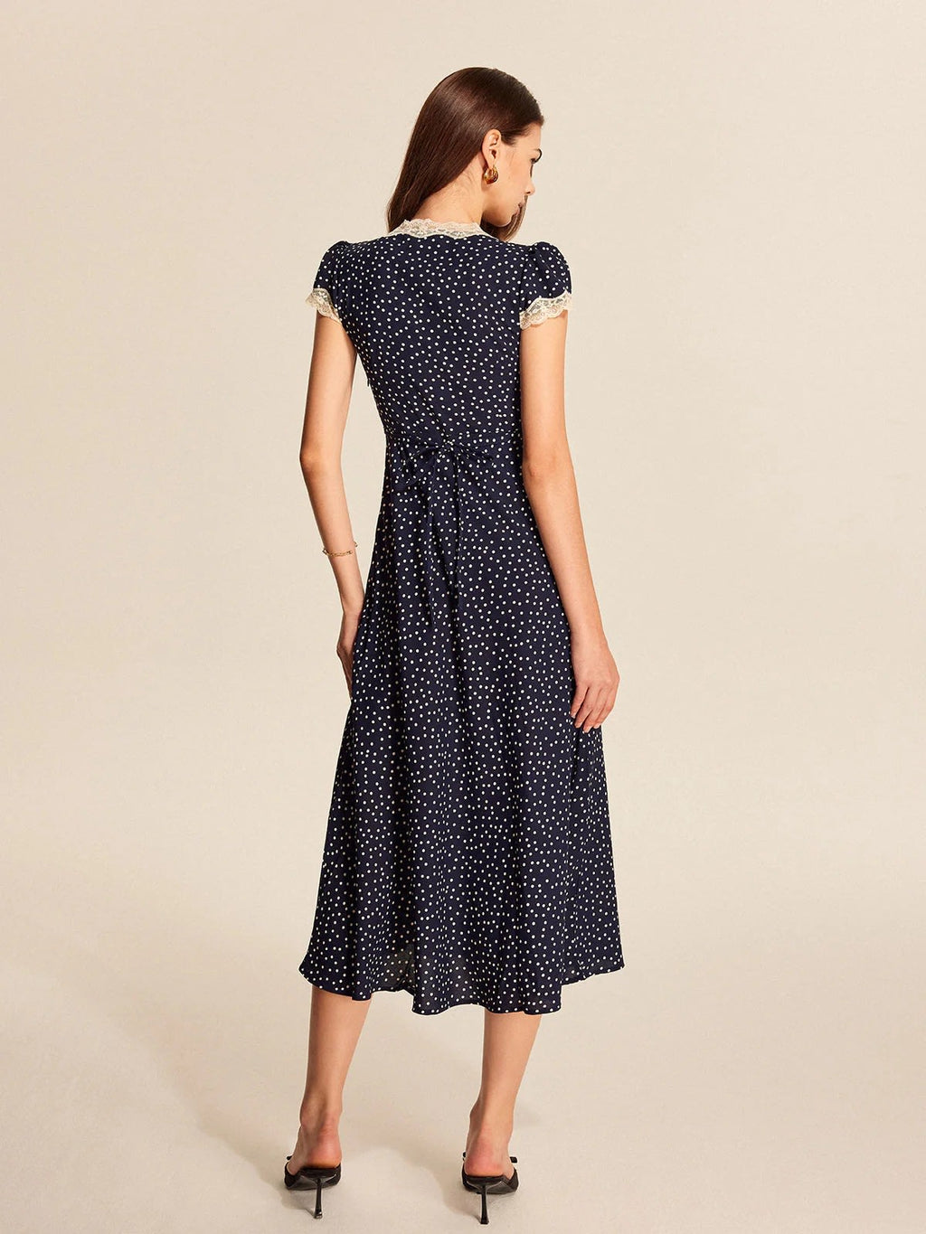 Lace trim polka dot midi dress with cap sleeves and V-neckline.