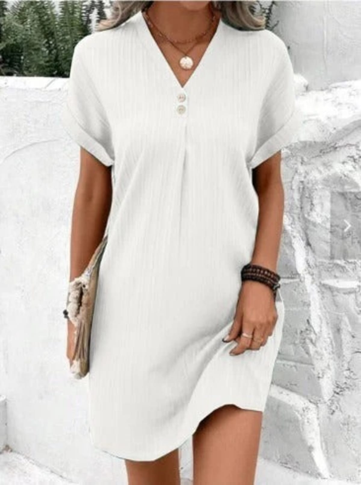 V-neck dress with layers and floral design for spring occasions.