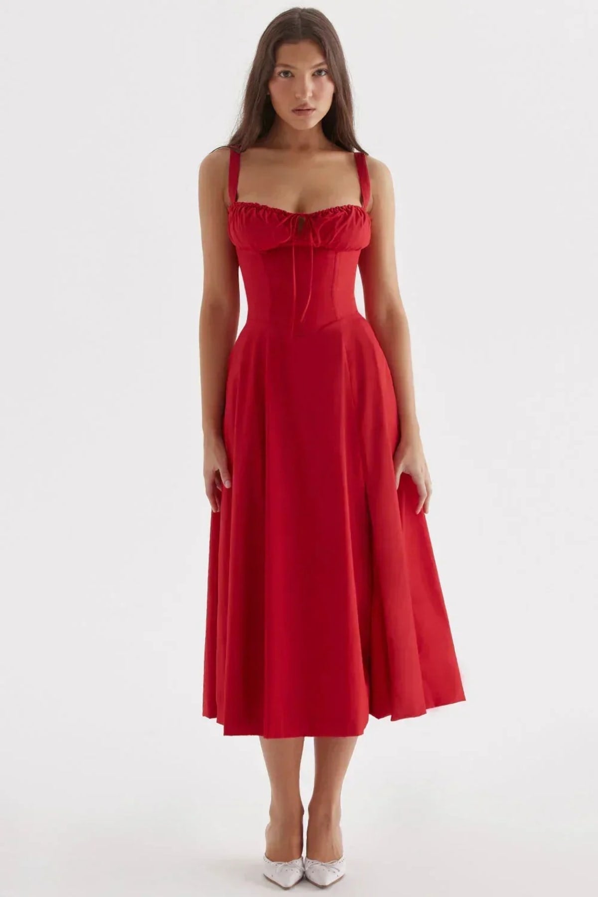 Woman in yellow midi sundress with ruched bust, corset bodice.