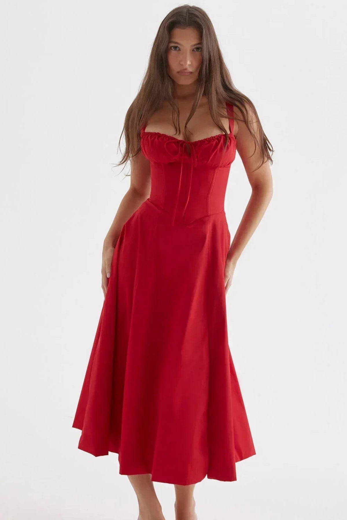 Woman in yellow midi sundress with ruched bust, corset bodice.