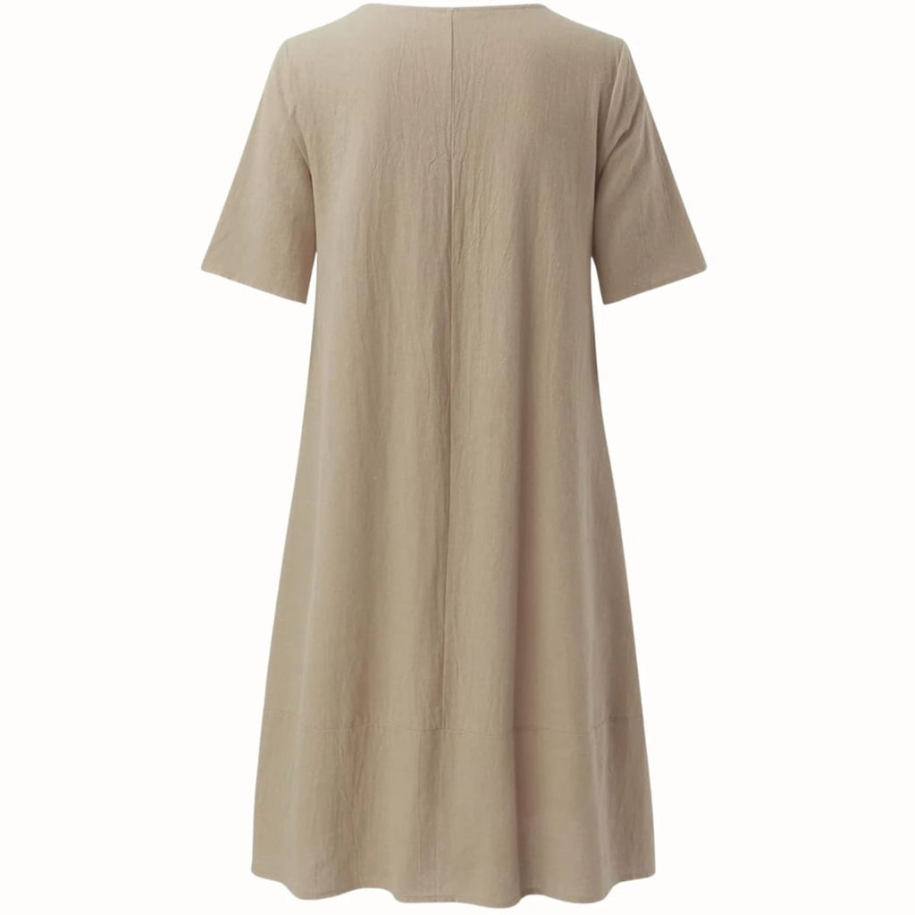 Relaxed fit midi dress with side pockets, lightweight fabric.