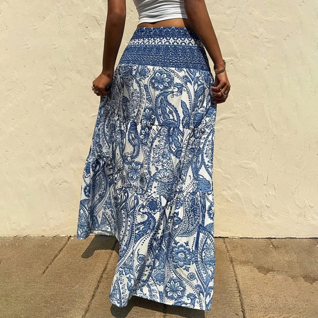 White tiered maxi skirt with blue paisley print and shirred waist.