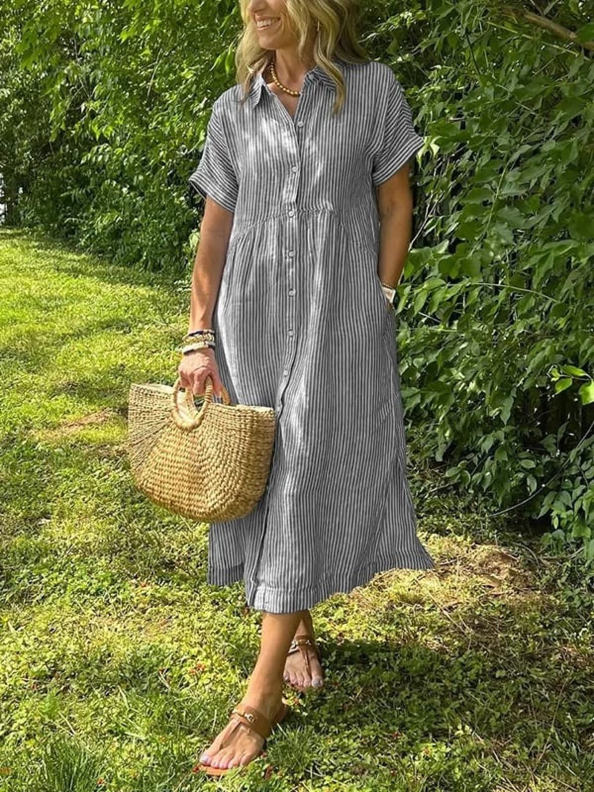 Long striped button-up shirt with collar and long sleeves.