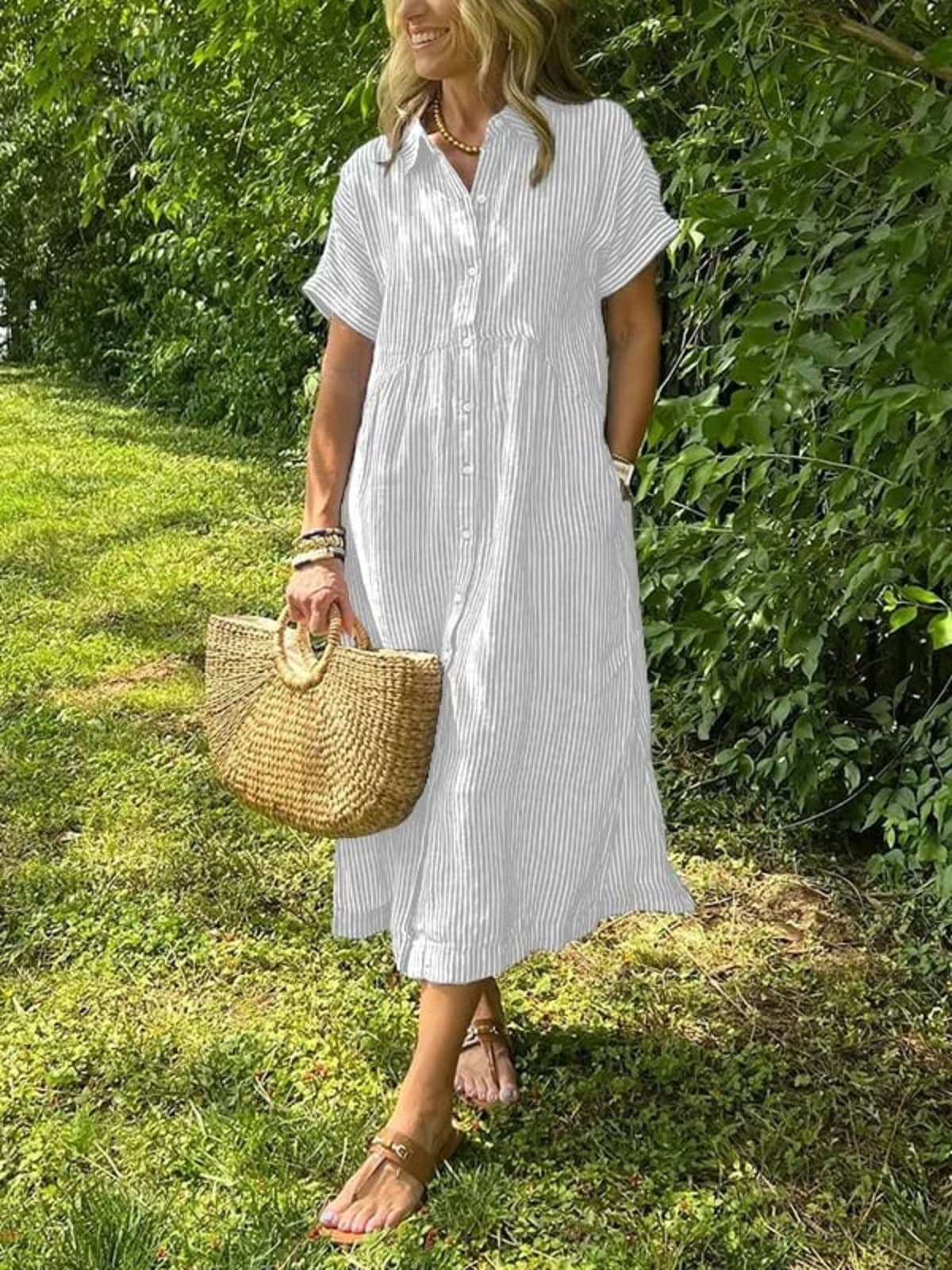 Long striped button-up shirt with collar and long sleeves.