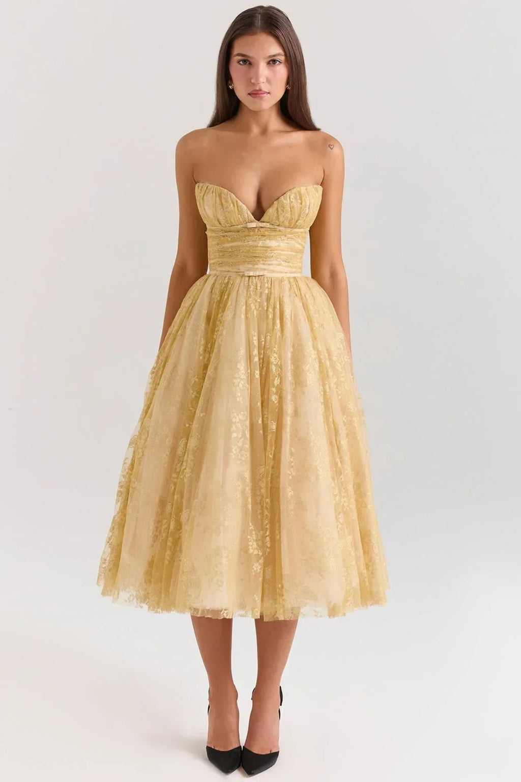 Woman in strapless midi dress with sweetheart neckline, full skirt.