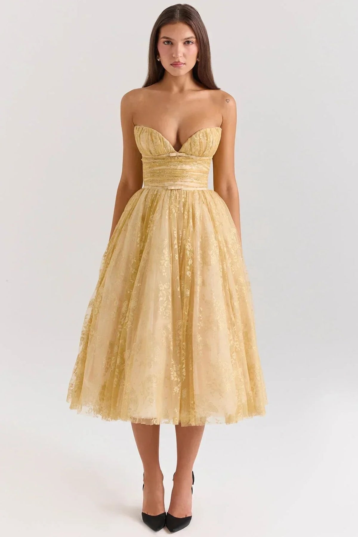 Woman in strapless midi dress with sweetheart neckline, full skirt.
