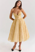 Woman in strapless midi dress with sweetheart neckline, full skirt.