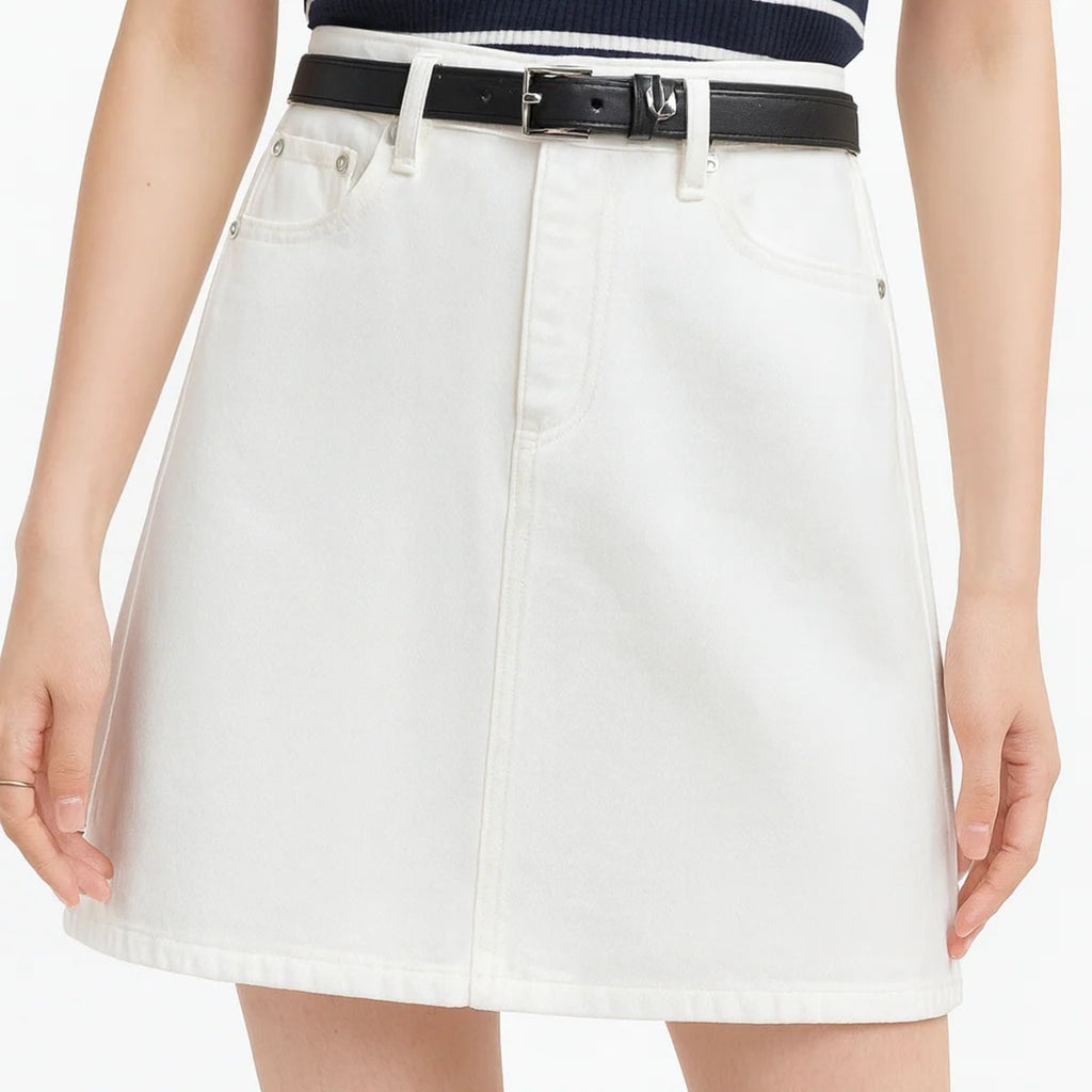 White denim mini skirt with A-line silhouette on hanger.