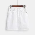 White denim mini skirt with A-line silhouette on hanger.