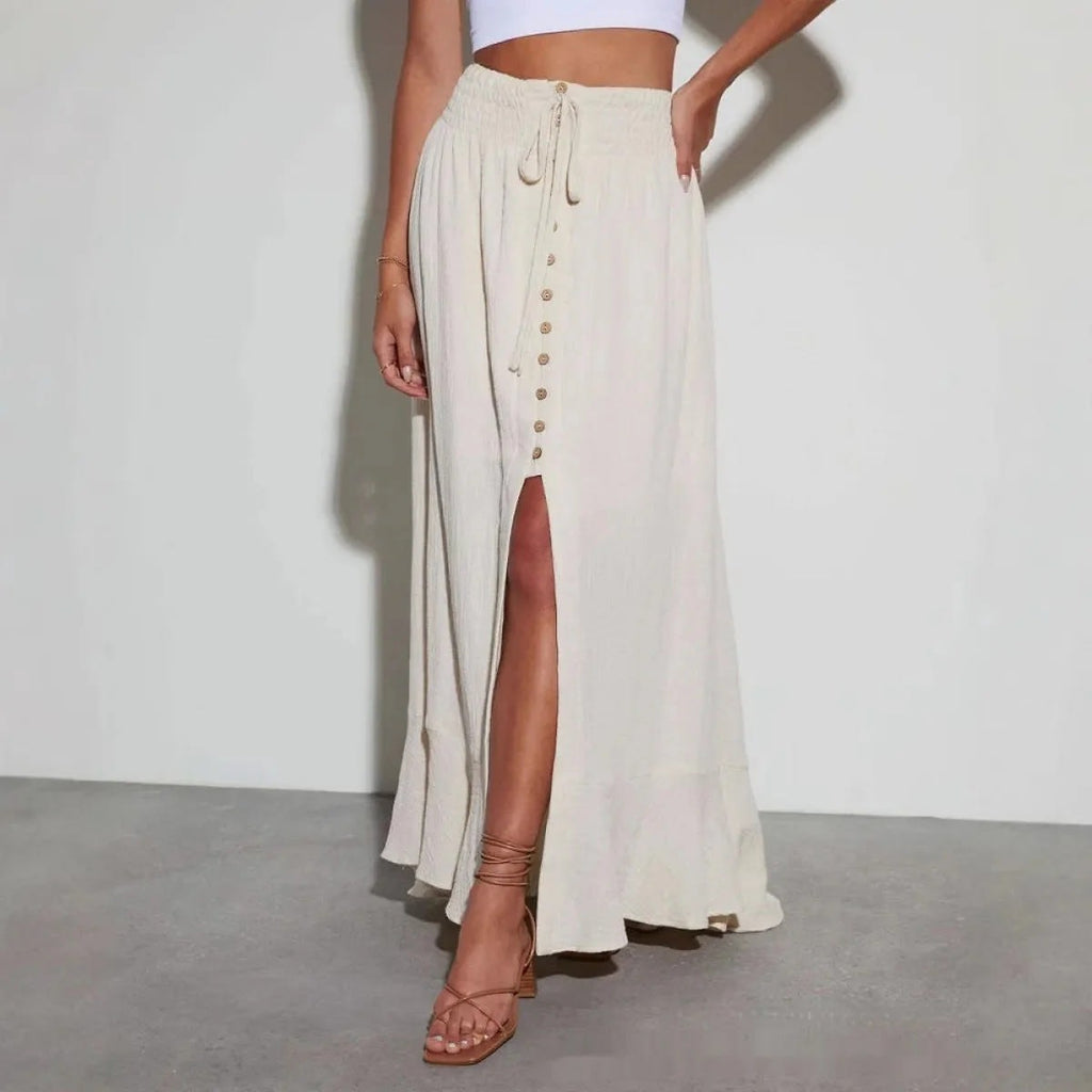 Woman wearing high-waisted button-front maxi skirt with drawstring waist.