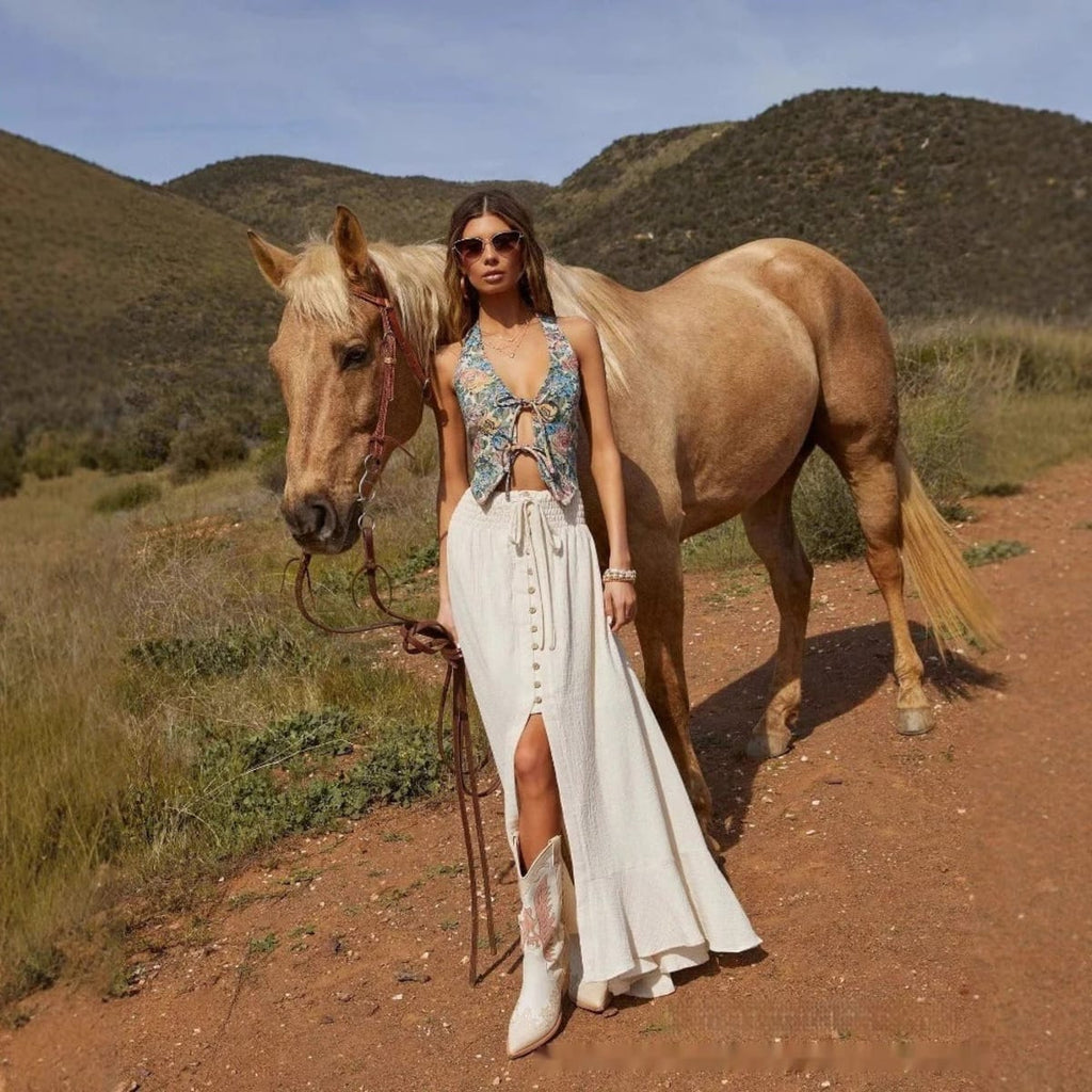 Woman wearing high-waisted button-front maxi skirt with drawstring waist.