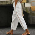 High-waisted tapered pants with button side stripe detail.