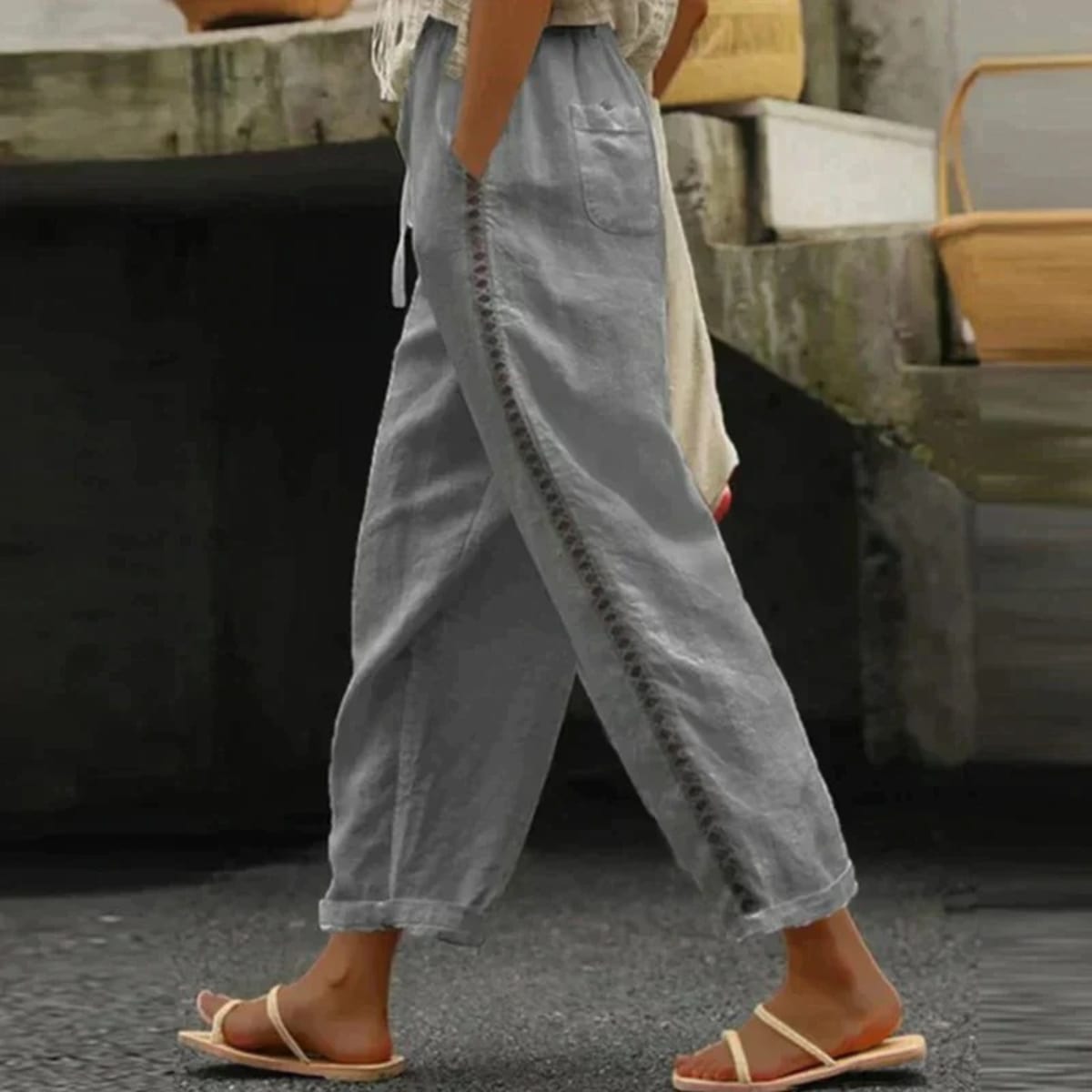 High-waisted tapered pants with button side stripe detail.