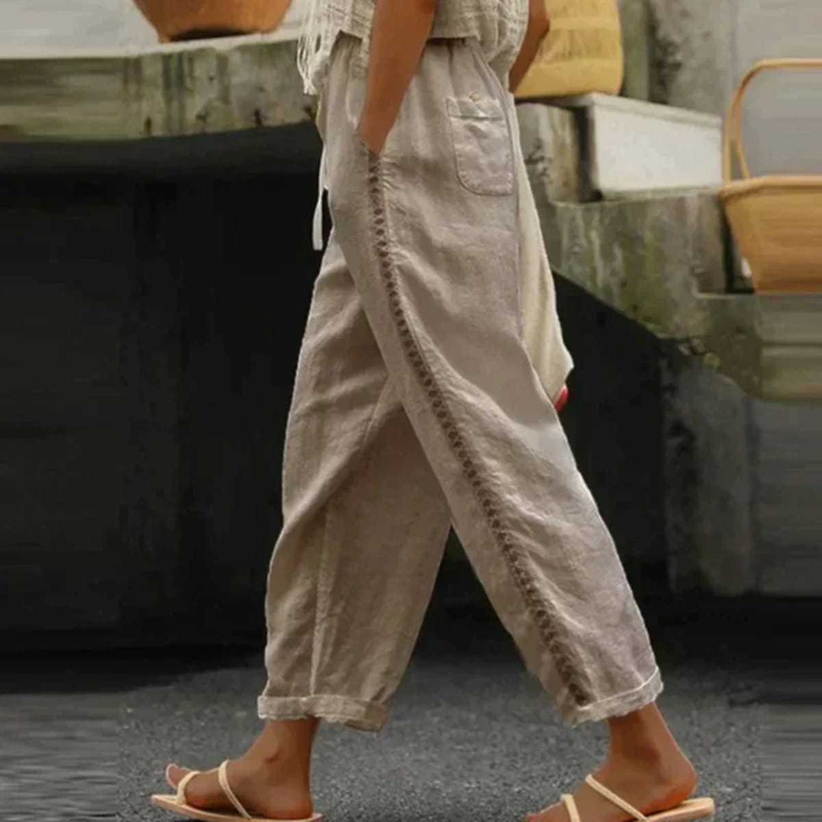 High-waisted tapered pants with button side stripe detail.
