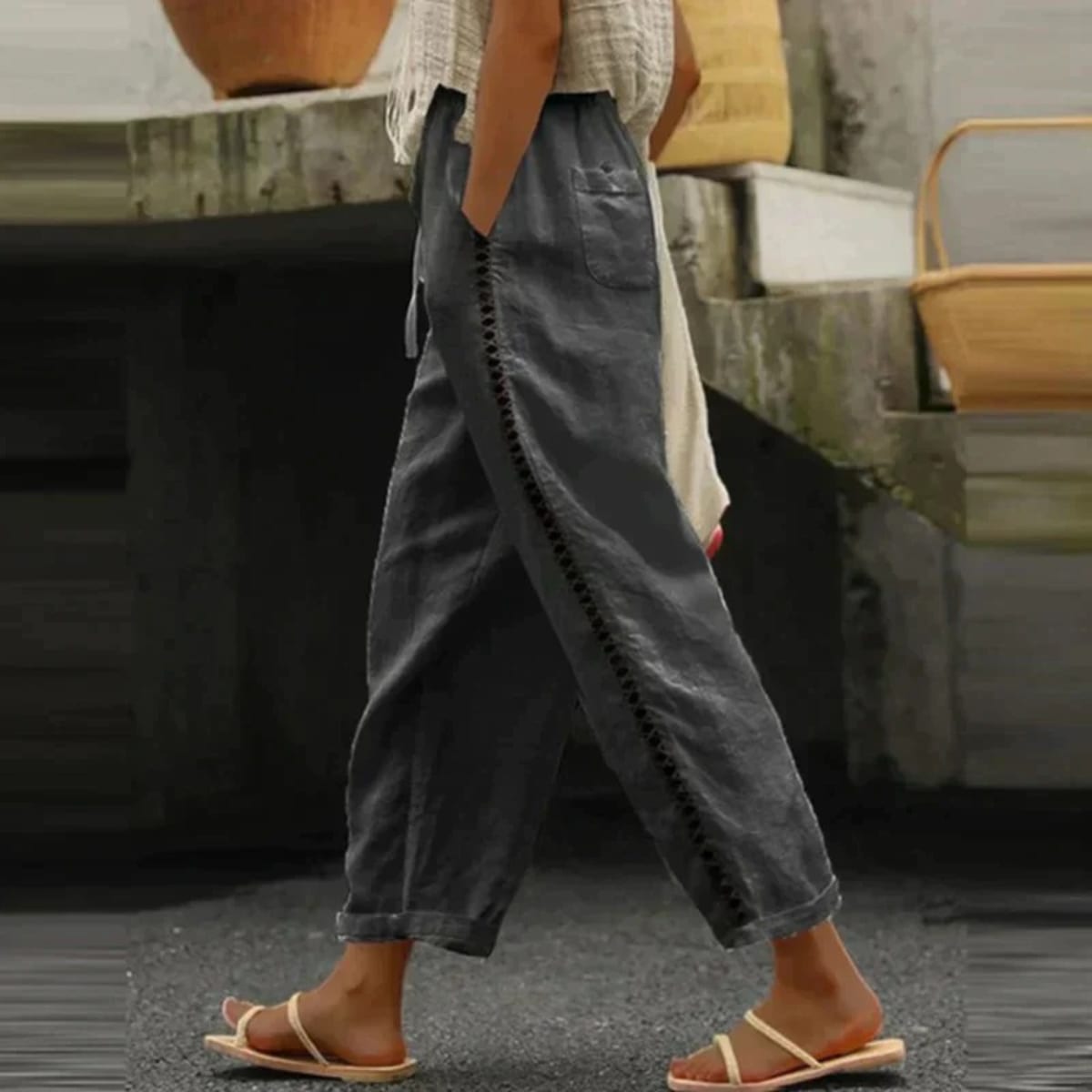 High-waisted tapered pants with button side stripe detail.