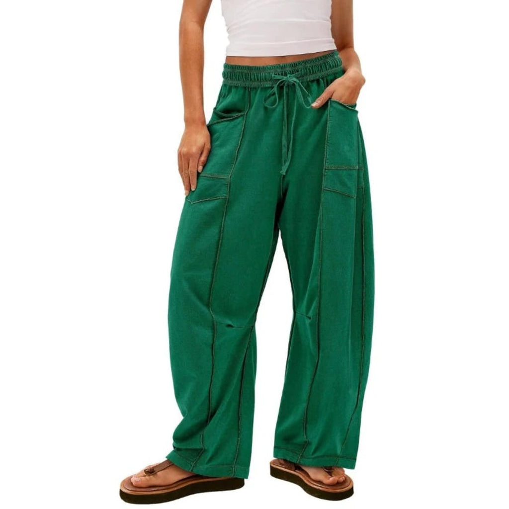 Wide-leg cargo pants with drawstring waist and patch pockets.