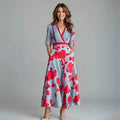 A floral wrap dress with a flowing silhouette and waist-emphasizing design.