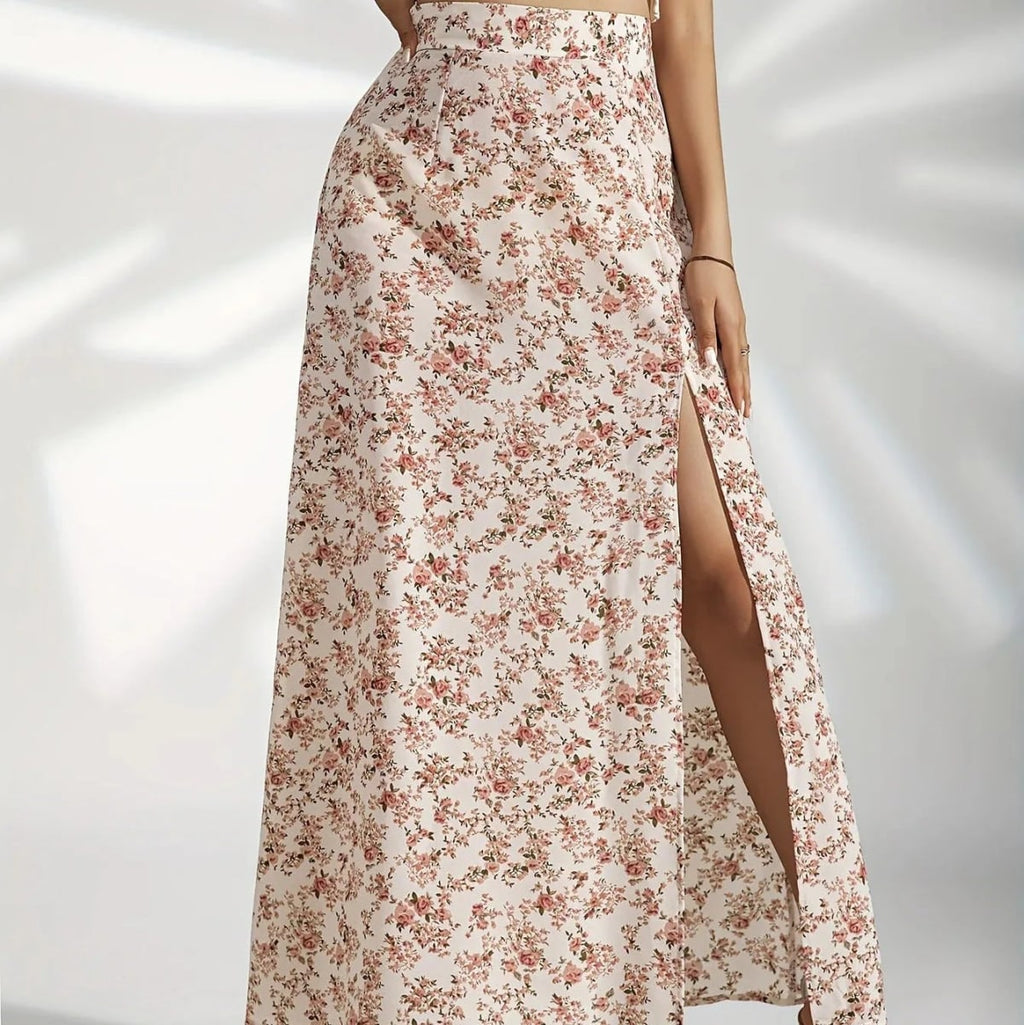 Woman wearing a floral maxi skirt with a side slit.
