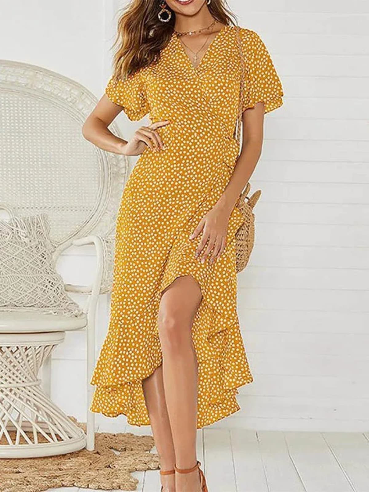 Maxi dress with V-neckline and ruffle accents for summer.