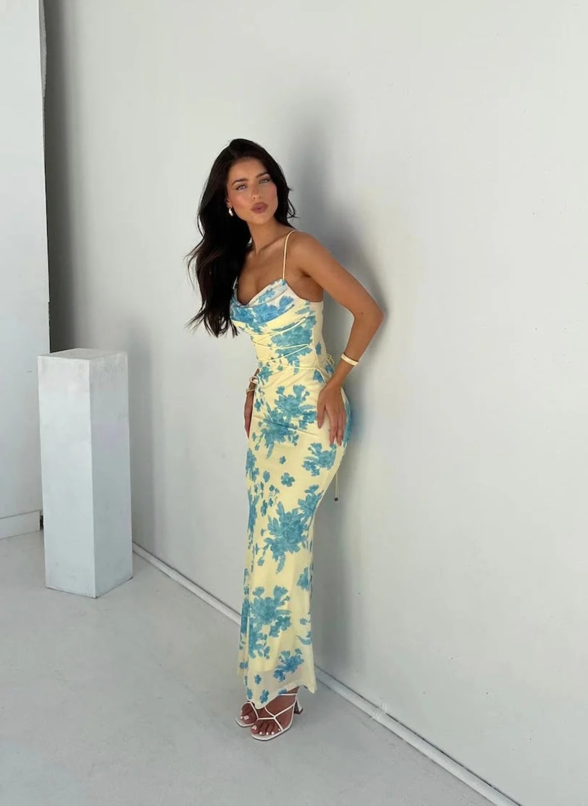 Sleeveless maxi dress with floral patterns and flowing silhouette