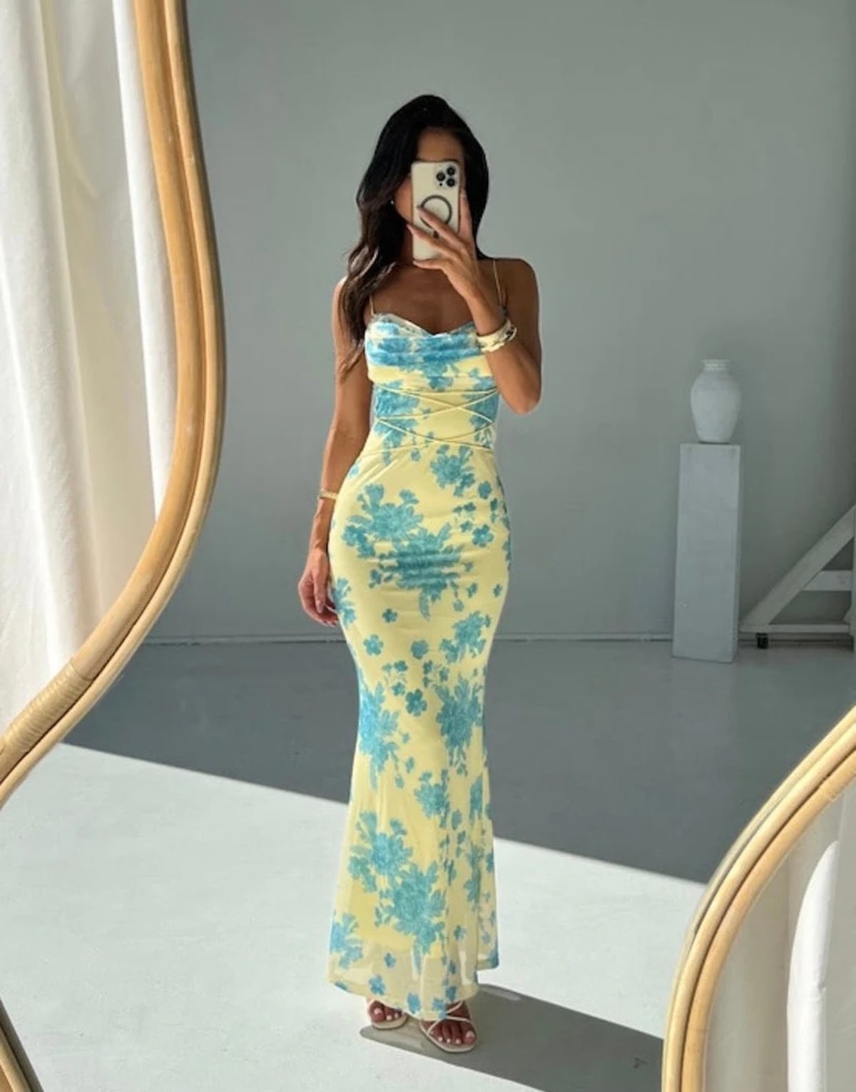 Sleeveless maxi dress with floral patterns and flowing silhouette