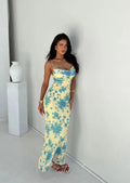 Sleeveless maxi dress with floral patterns and flowing silhouette