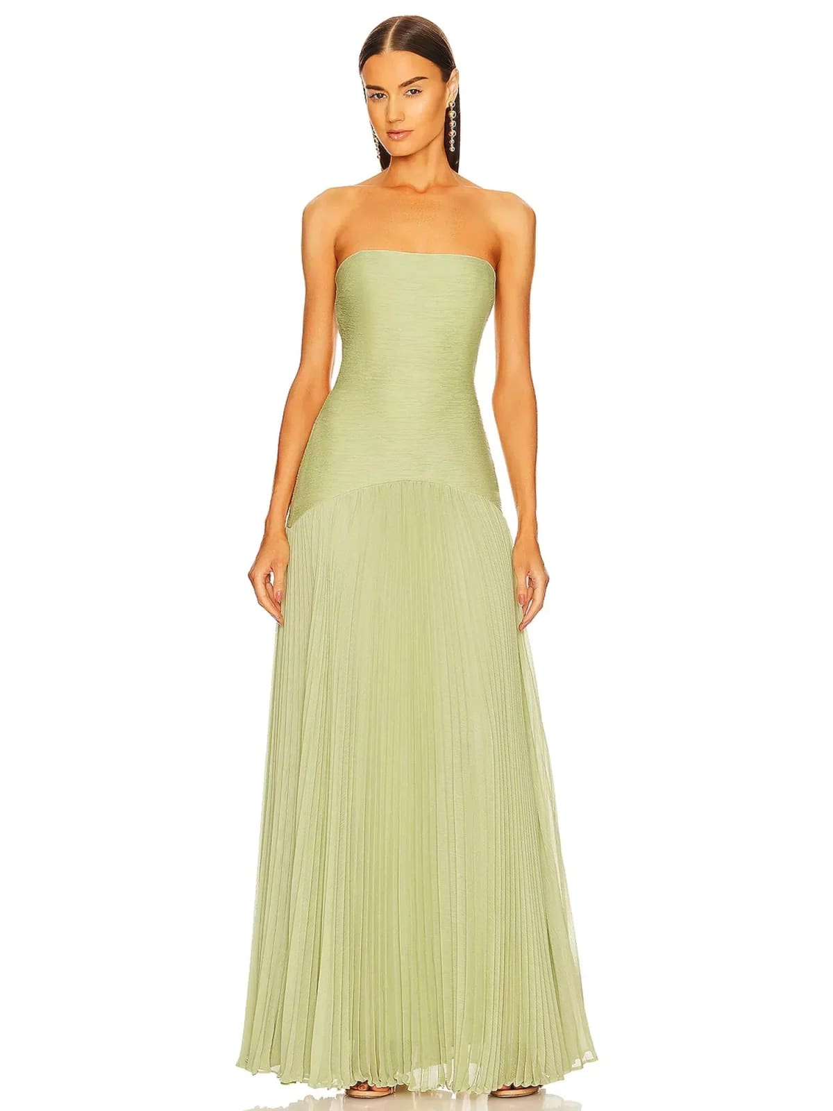 Strapless maxi dress with pleated skirt, worn at a formal event.
