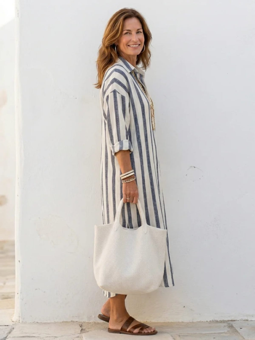 Women's striped long sleeve midi shirt dress with button front.
