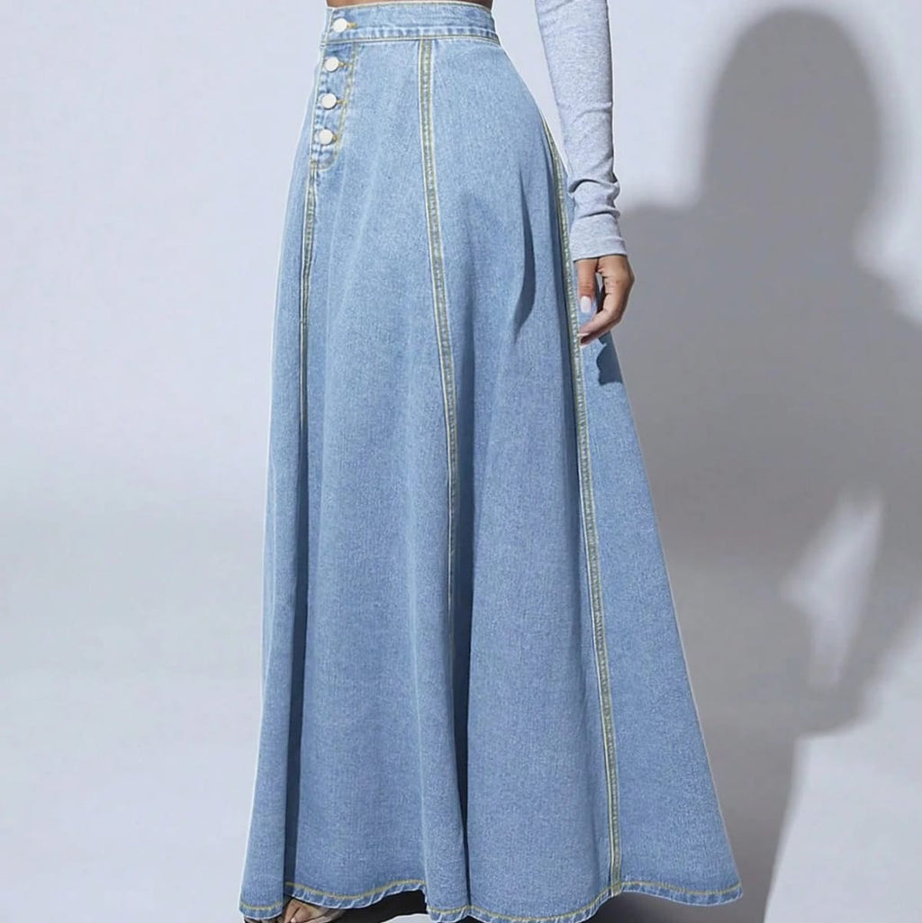 Model wearing a high-waisted denim maxi skirt with button front.