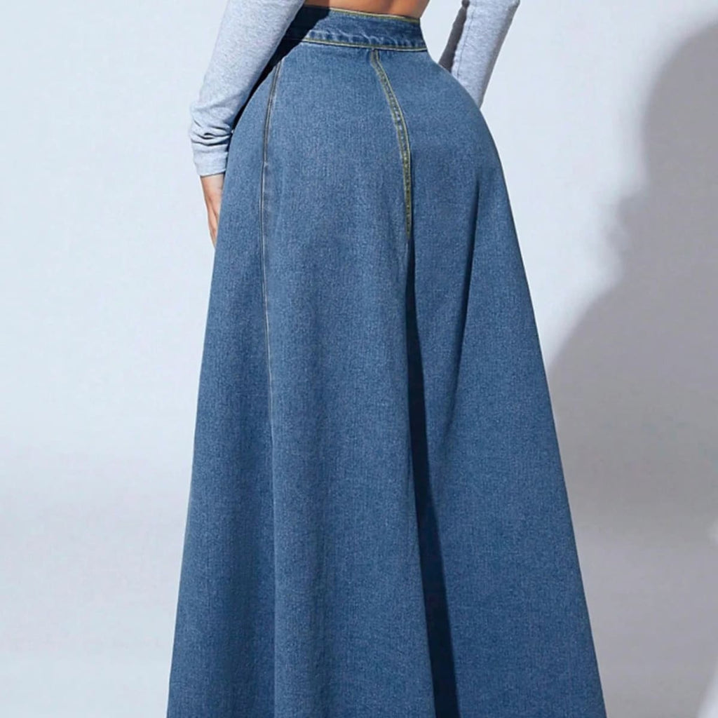 Model wearing a high-waisted denim maxi skirt with button front.