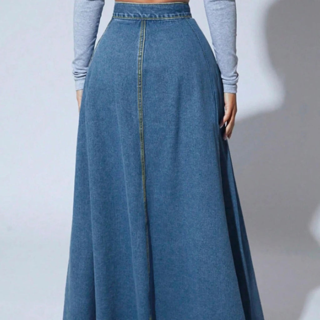 Model wearing a high-waisted denim maxi skirt with button front.