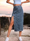 Woman wearing a high-waisted denim midi skirt with a button-front and side slit outdoors.