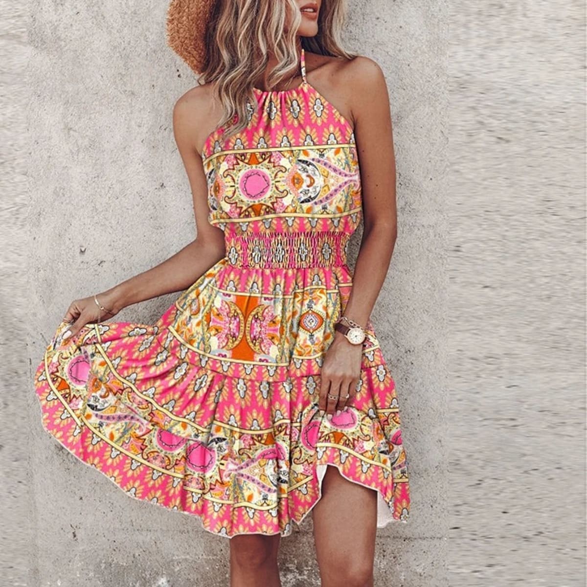 Women's draped lace halter dress with a flowy silhouette.