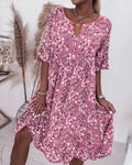 Woman wearing an elegant shift dress in a relaxed fit.