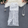 Sleeveless white lace midi dress with embellished skirt and button-down front.